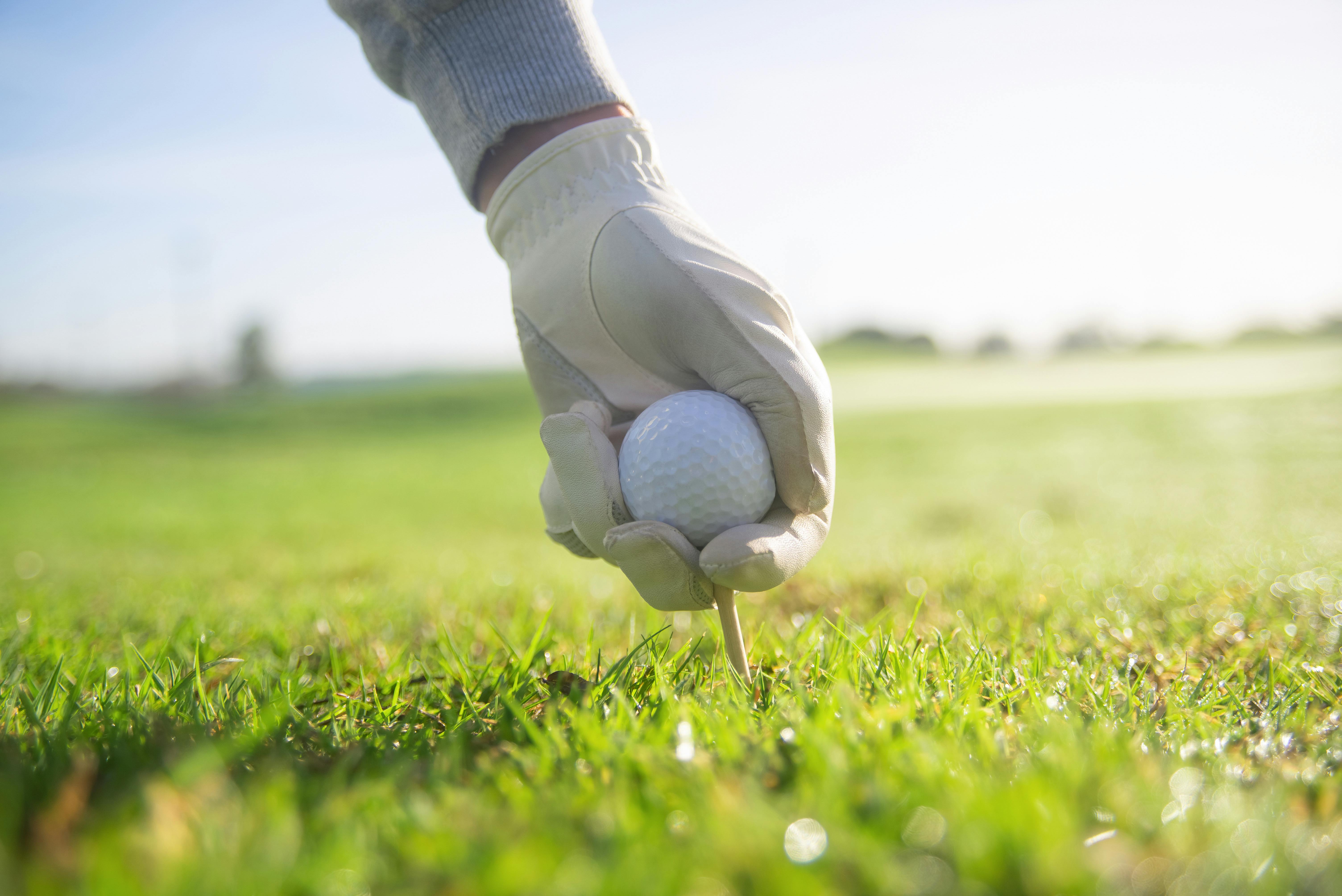 Placing Golf Ball on Tee
